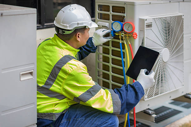 Professional Heat Pump Repair technician working in Doss, TX